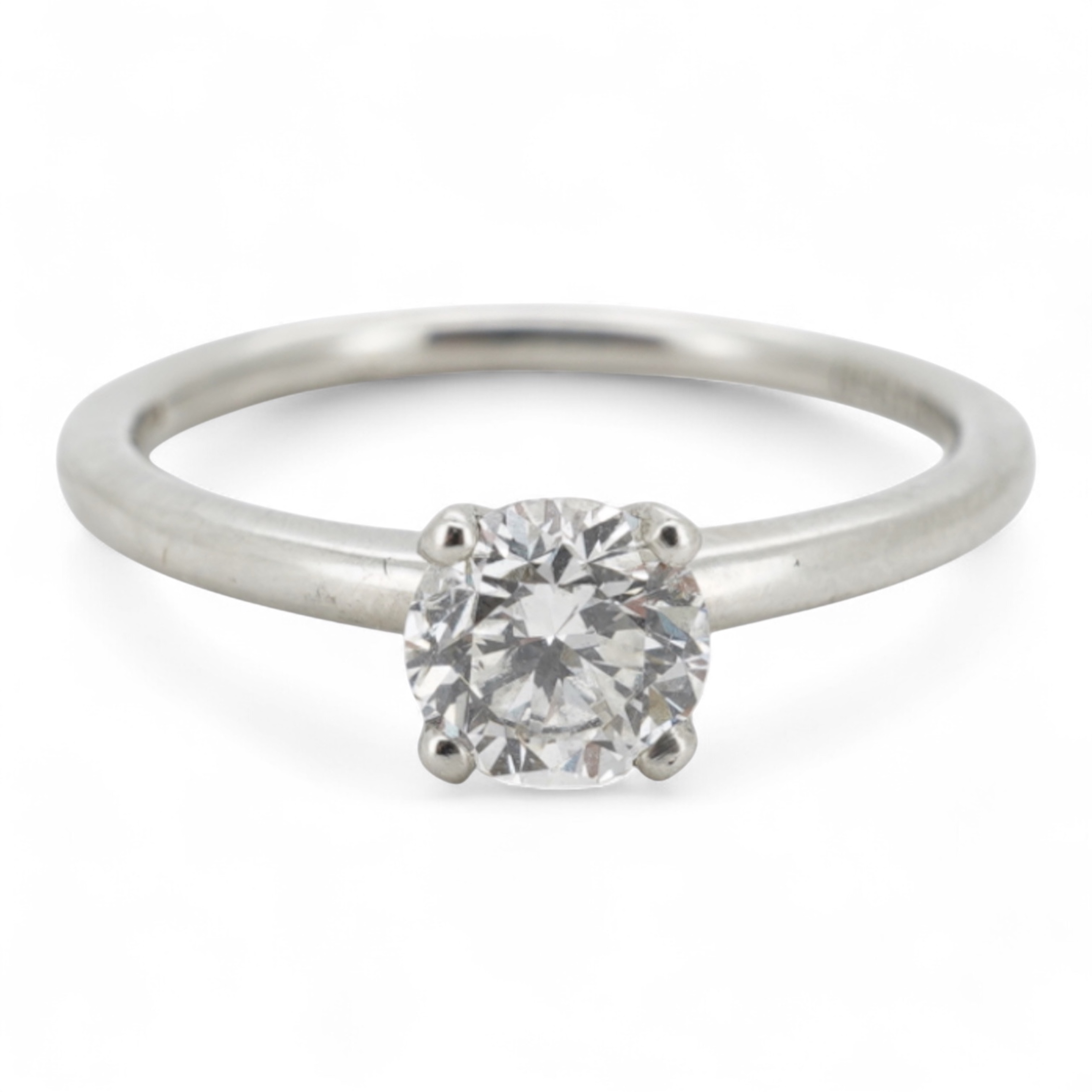 A diamond ring, claw-set with a brilliant-cut diamond weighing approximately 0.52 carats, mounted in platinum, size L1/2, British hallmarks, gross weight approximately 3 grams